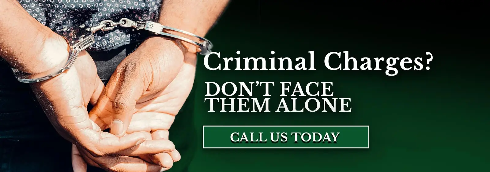 Man handcuffed in Covington after being arrested with the text Criminal Charges?